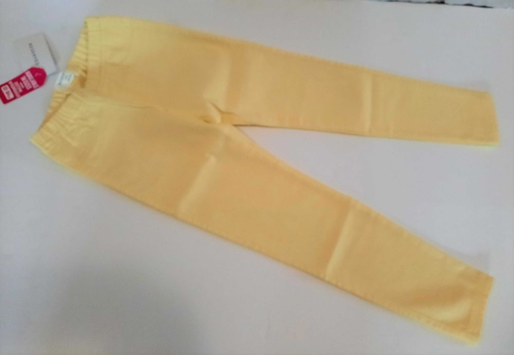 Tregginsy limonkowe żółte legginsy spodnie Reserved roz 128