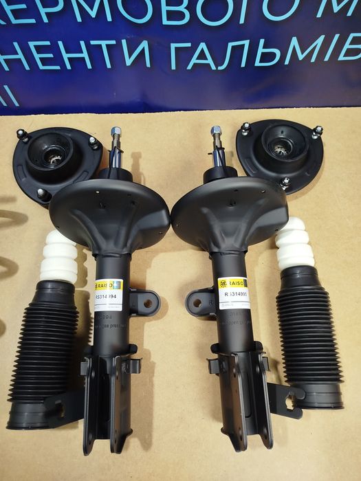 Амортизаторы Туксон Комплект с опорами пыльниками отбойниками