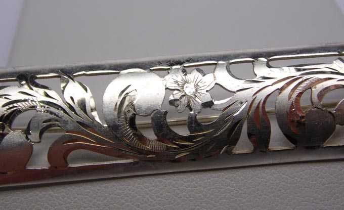 Srebrna broszka wycinane kwiaty handarbeit.