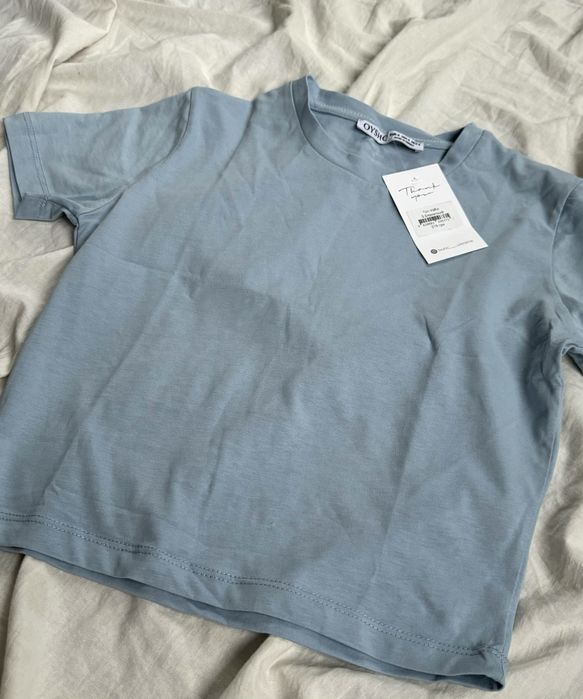 Топ. Блакитного кольору