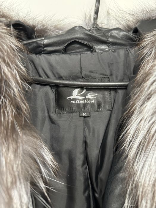 Женский пуховик с мехом чернобурки