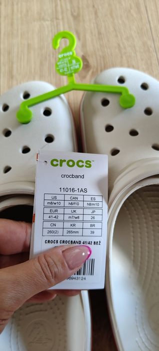 Nowe klapki CROCS beżowe z różowym napisem na tyle rozm.40,5