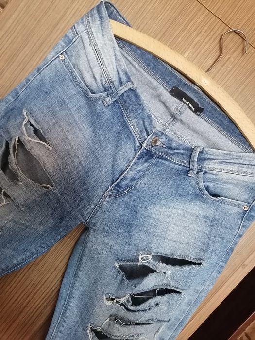 Spodnie jeansy Tally Weijl z dziurami