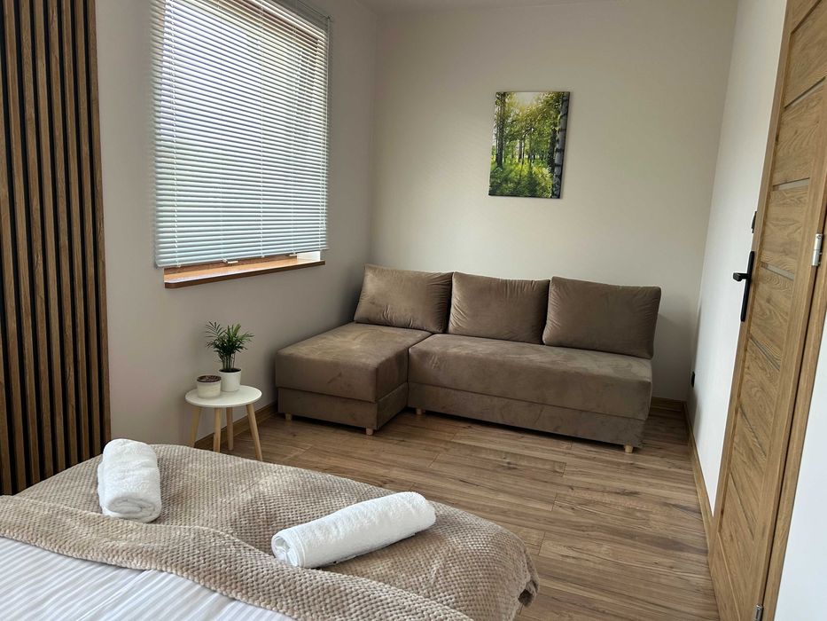 Pod Brzozami-domki całoroczne Balia jacuzzi noclegi Bałtów