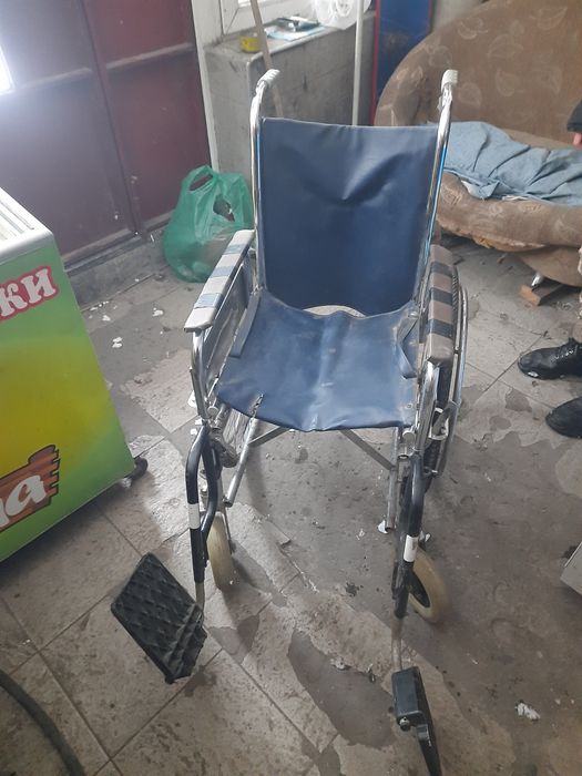 Инвалидная коляска в рабочем состоянии.