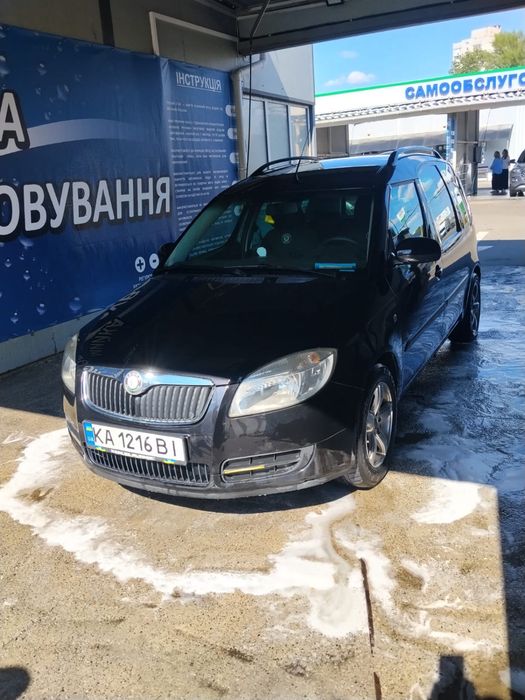 Skoda Roomster      Шкода