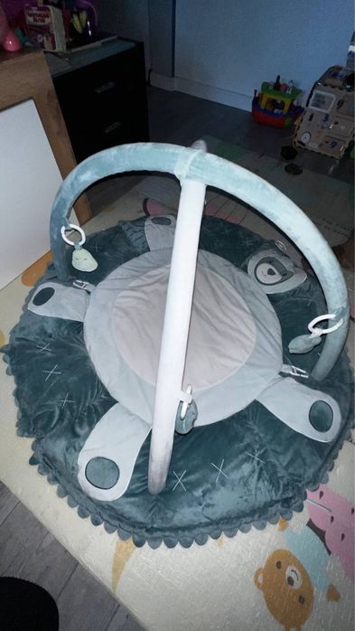 Розвиваючий  килимок Bambinelli "Єнот Алекс" з дугами.