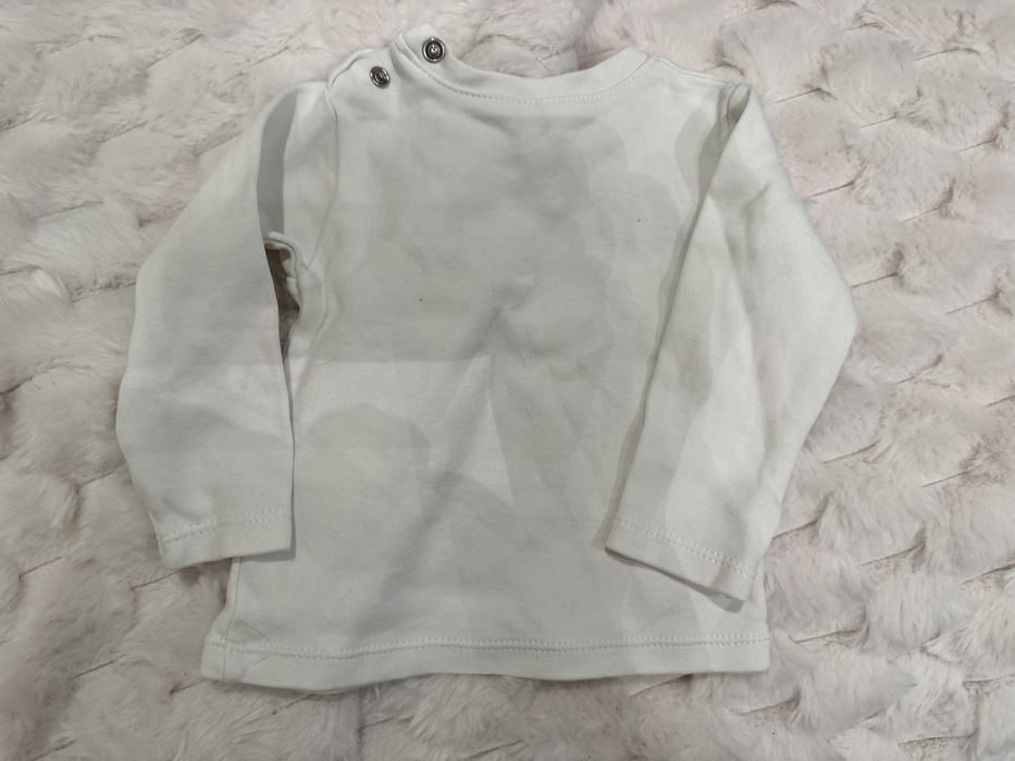 Sprzedam  białą bluzeczka dla niemowlaka