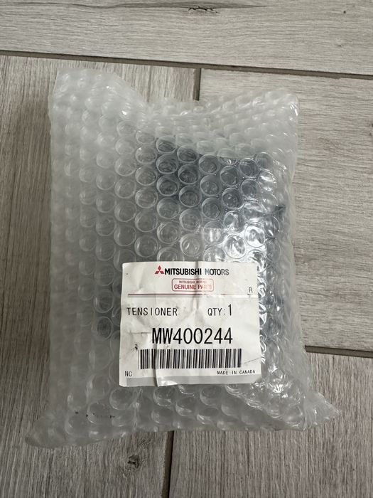 Роликовий модуль натягувача  ременя MW400244 Mitsubishi