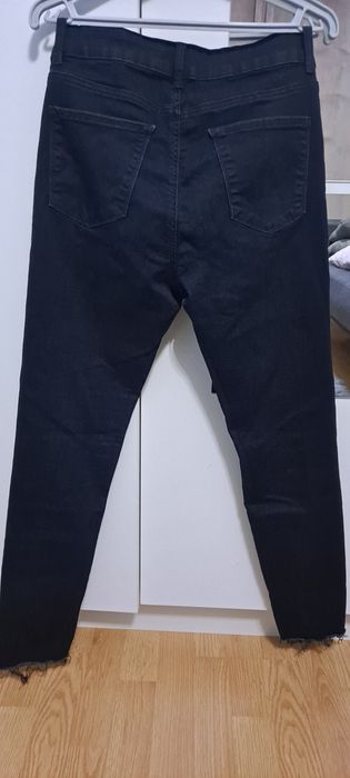 Granatowe  spodnie jeansowe z dziurami  Orsay r 38