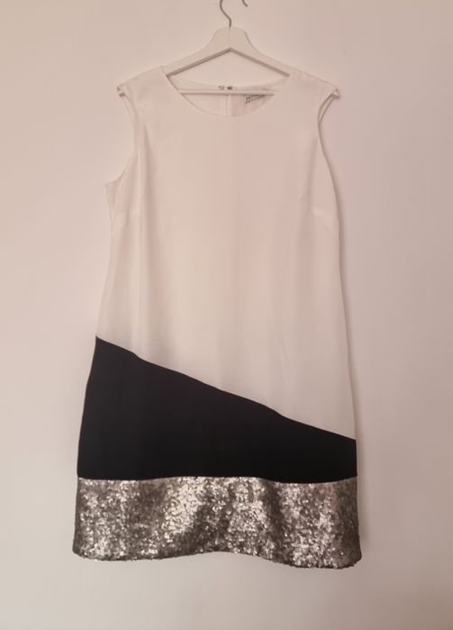 Sukienka letnia elegancka bez rękawów rozmiar L/XL nowa Definitions