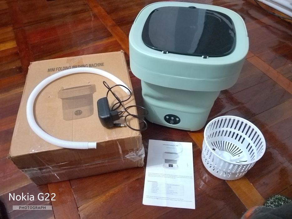 Портативна складана пральна машинка з центрифугою й ультрафіолетом.