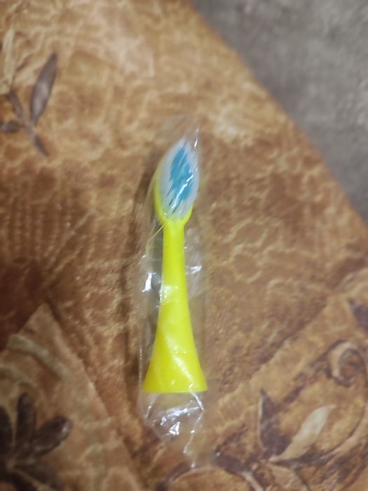 Додаткова насадка до жовтої електричної зубної щітки з дракончиком