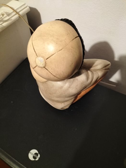 Boneco de porcelana antigo