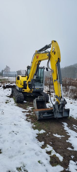 Usługi Koparko-ładowarka koparka  niwelacja pracę ziemne wykopy