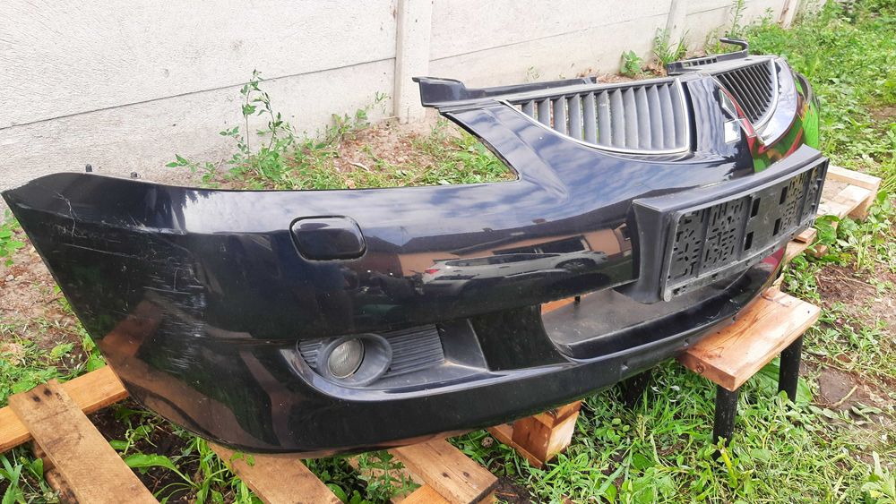 Mitsubishi Lancer VII 7 zderzak przedni kompletny spryski halogeny