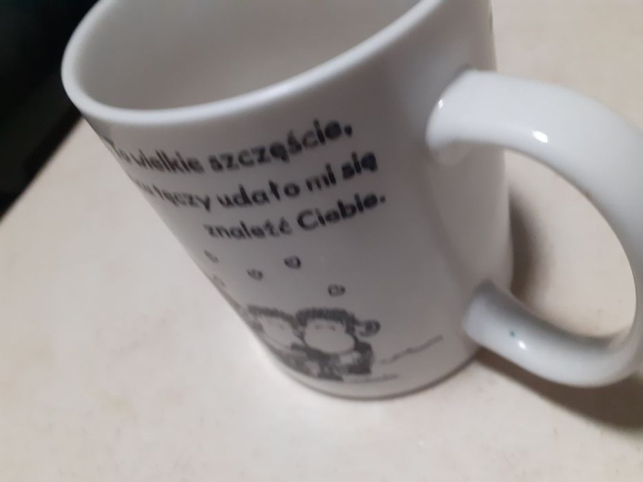 Kubek z ciekawa sentencją