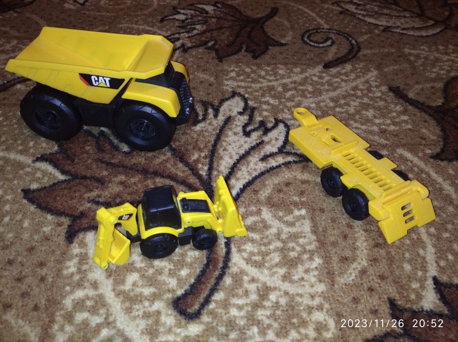 машинки CAT бу вантажівка самоскид трактор