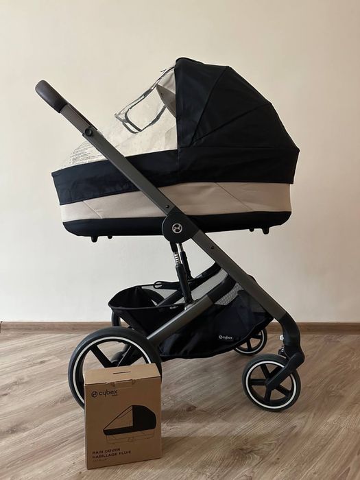 Дощовики, конверти, аксесуари Cybex, адаптери, колеса, корзини