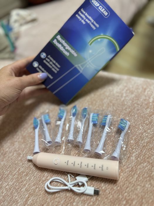 Новая электрическая зубная щетка