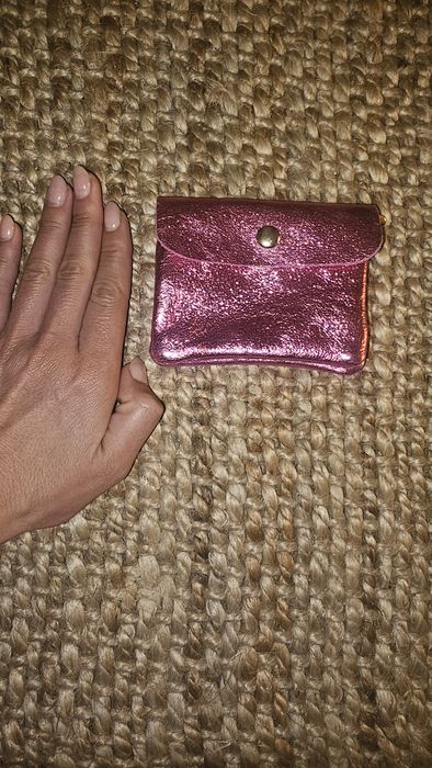 Porta moedas cor de rosa  pelo novo por estrear 
Pele genuína nunca usado por estrear