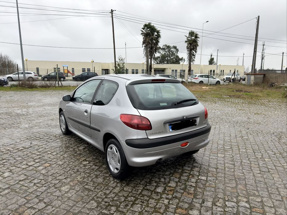 100 mil kms 206 comoletamente nova