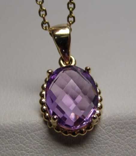 Złota zawieszka naturalny fasetowany ametyst.