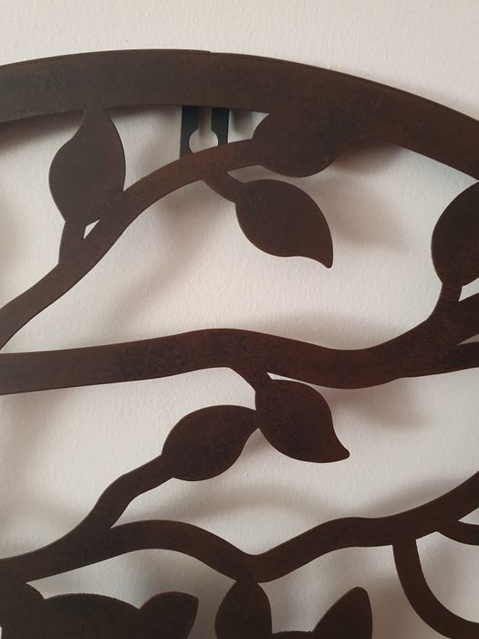 Peça decorativa em metal para pendurar