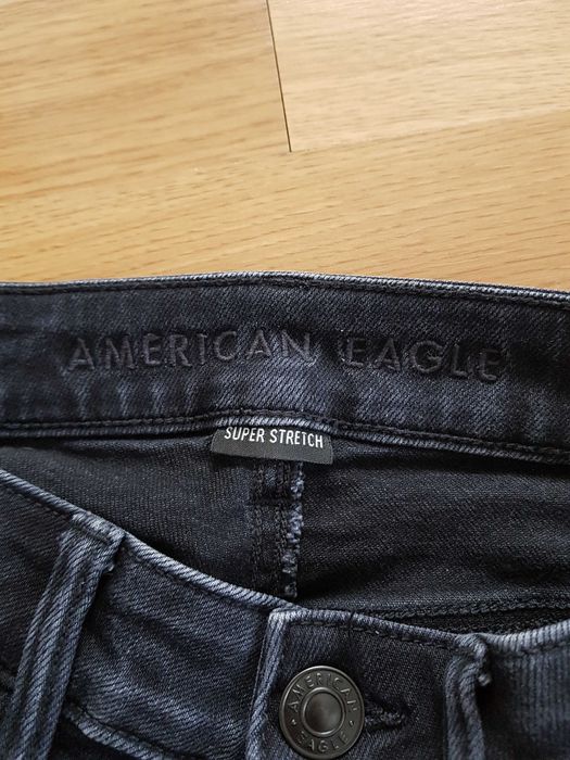 Czarne spodnie jeansowe z dziurami 34/36