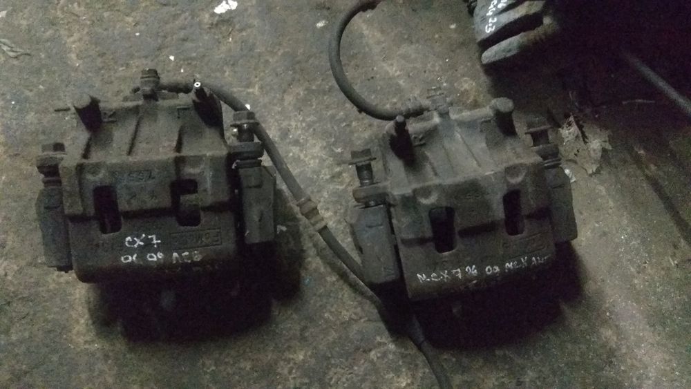Суппорт Мазда СХ7 передний задний L/R L2Z6-26-98ZA / L2Z6-33-99ZA