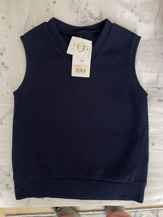 Нова дитяча жилетка