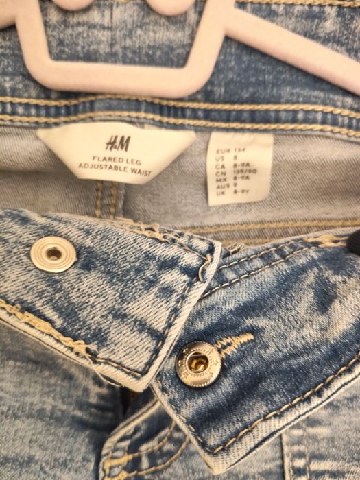 H&M spodnie dla dziewczynki dżinsy dzwony flared leg, 134