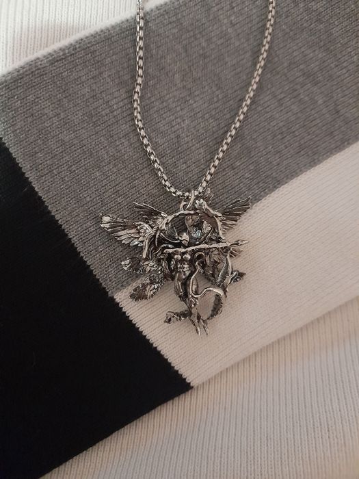 кулон металічний