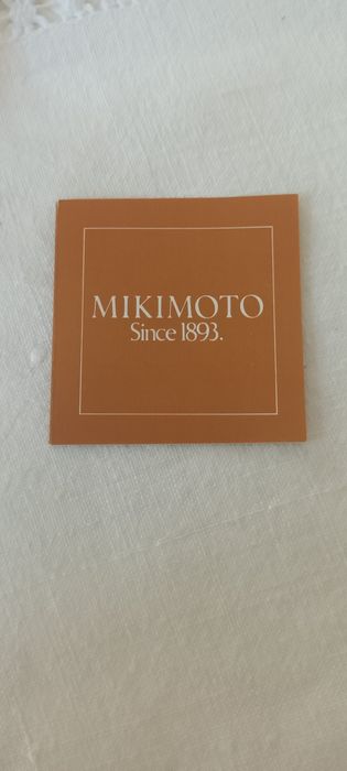 Negócio de oportunidade. Botões de punho Mikimoto