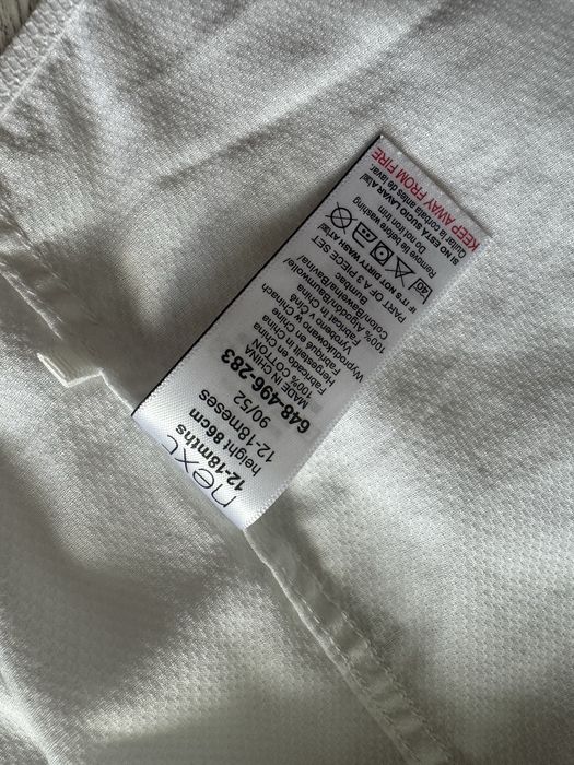 Біла сорочка next