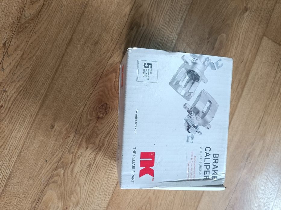 Гальмівний супорт передній правий NK 213058  Mitsubishi Pajero III -IV