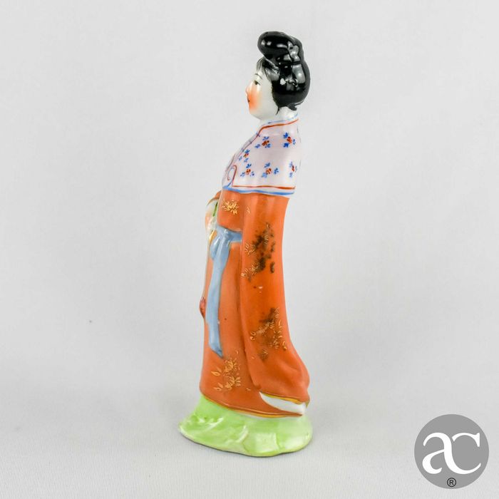 Figura porcelana da China de uma Mulher chinesa