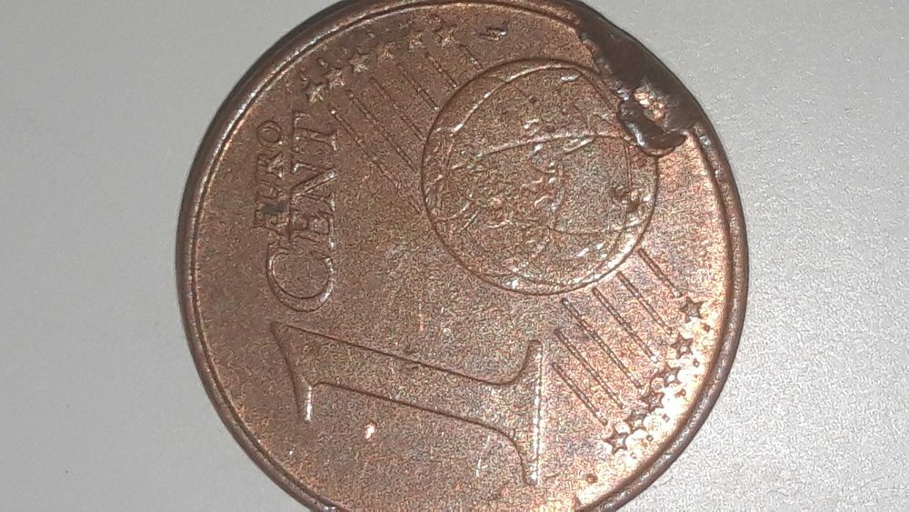 3 moedas de 1 centimo com defeito.