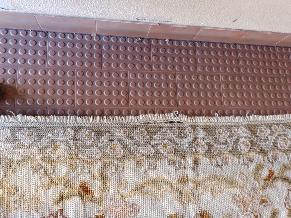 Tapetes de arraioloscom um pequeno defeito