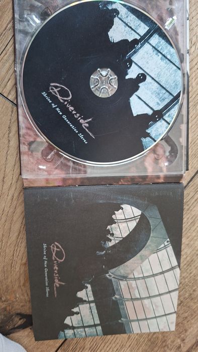Płyty CD Riverside z autografami