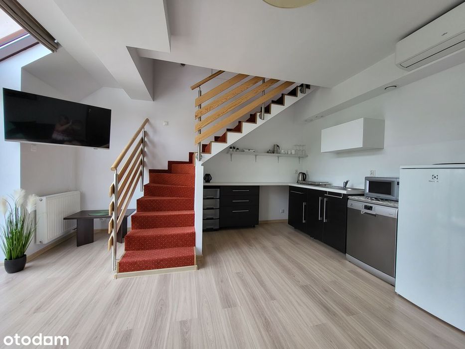 Przestronny apartament z balkonem i windą nad jeziorem Pluszne