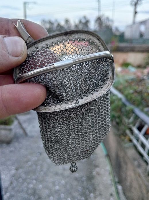 Porta moedas de prata.