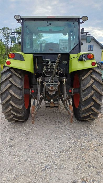 Claas Axos 320 z ładowaczem czołowym Faucheux Captor 100