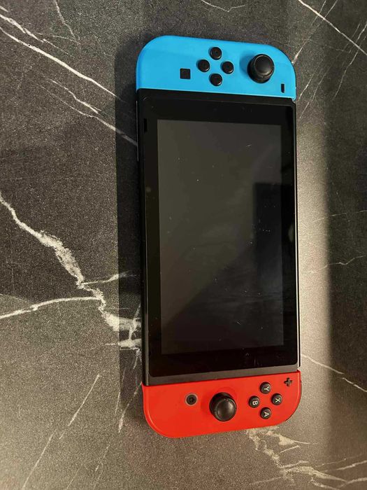 Nintendo Swich + 4 Gry