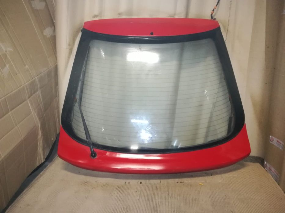 Tampa mala mazda 323