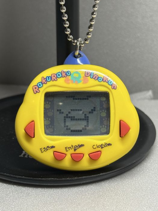 Тамагочи динозавр серии динки Dinkie Dino rakuraku dinokun tamagotchi