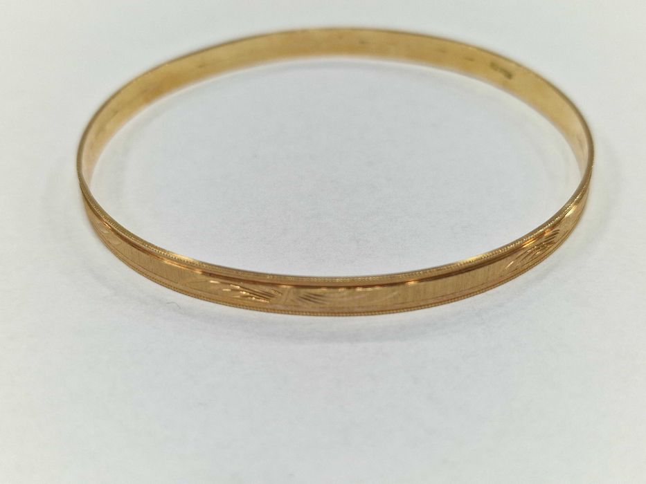 Złota bransoletka damska/ Sztywna/ Owalna/ 750/ 11.96 gram/ 1963-86