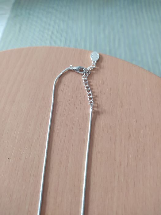 Colar flor prateado NOVO