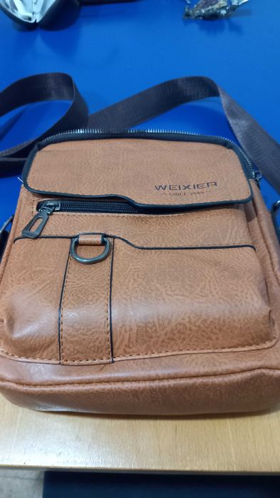Mochila tira colo pele