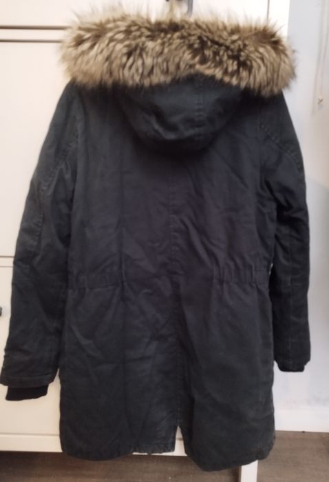 Quispo com carapuço e forrado